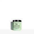 Mint green tub of Bumble and bumble Seaweed Whipped Scalp Scrub on a minimalist background.