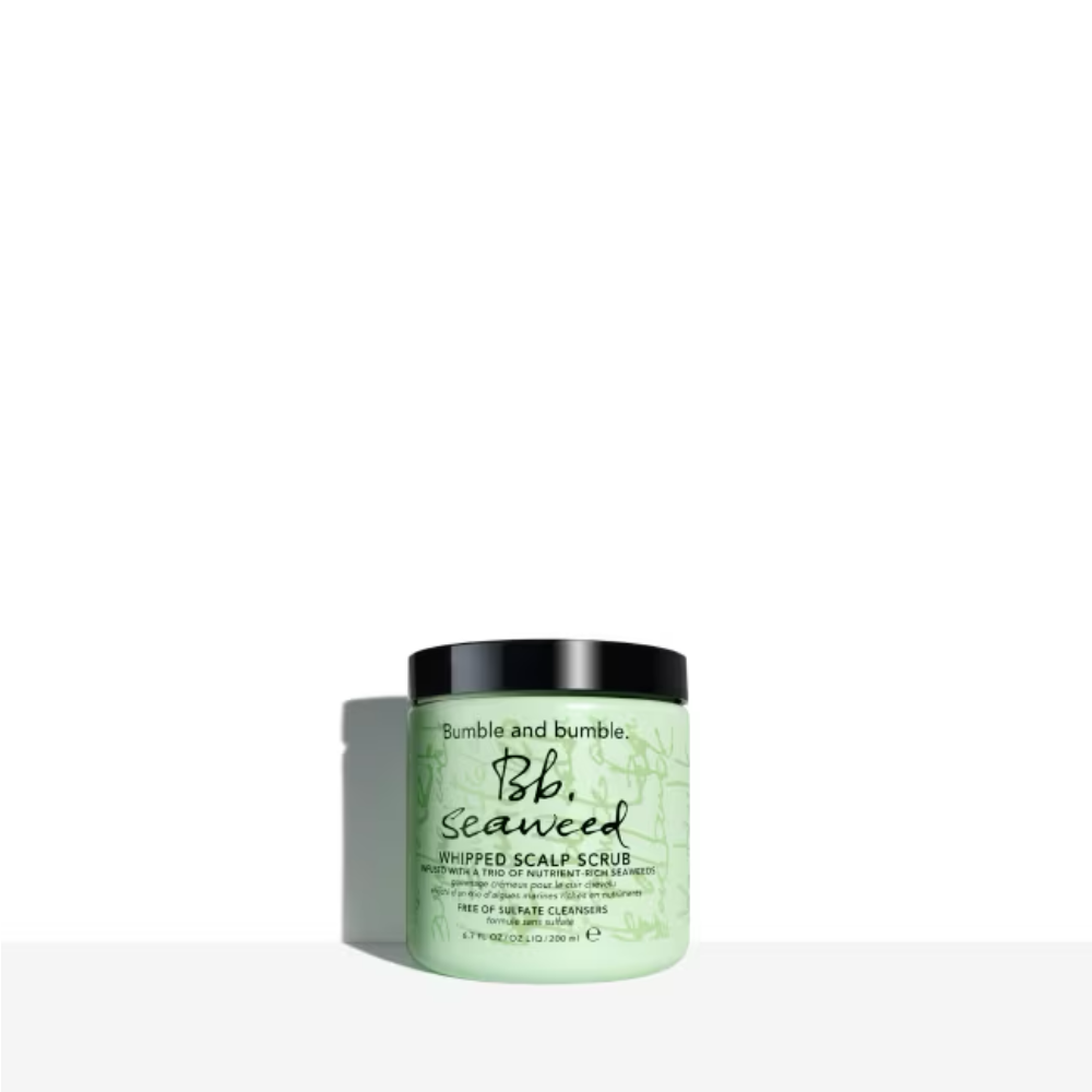 Mint green tub of Bumble and bumble Seaweed Whipped Scalp Scrub on a minimalist background.