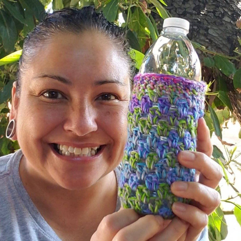 Close up of a crocheted koozie showcasing the Nebula color variation from the Cool Zee Koozie pattern.