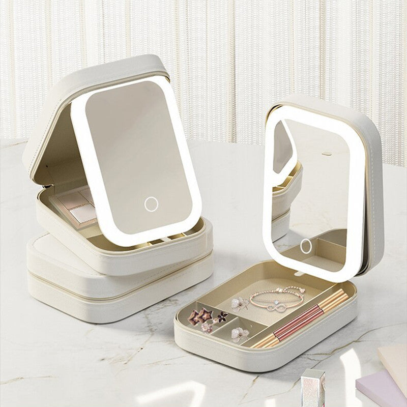 A portable makeup storage box with an LED mirror, shown in pastel colors with cosmetic items organized inside.