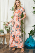 A vibrant paisley print maxi dress by Celeste with short sleeves and pockets.