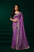 Elegant lavender net saree paired with a contrast black velvet blouse for parties