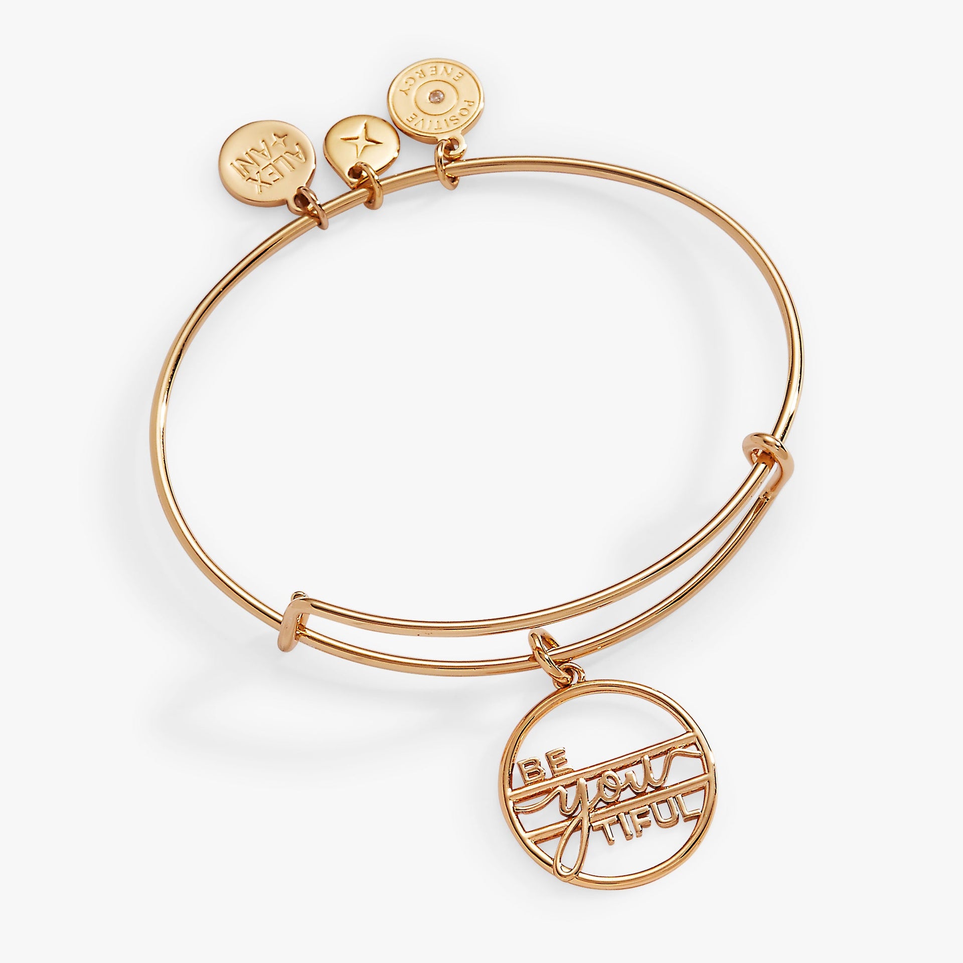 Minimalist gold Be-You-Tiful charm bangle on a neutral background