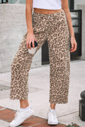 Model wearing Winnie leopard print straight leg loose jeans with white sneakers