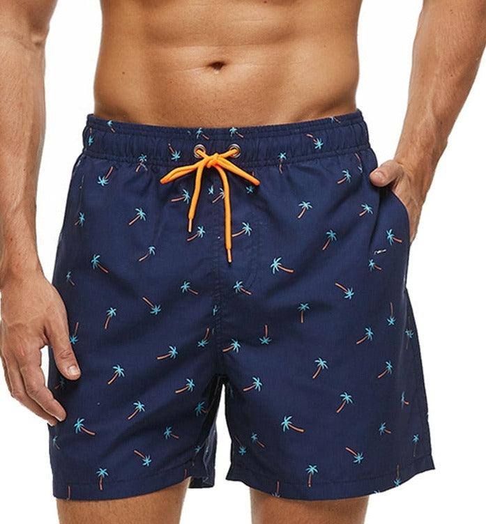 Men wearing tropical print quick-dry board shorts at the beach