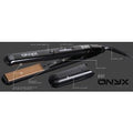 Beaut Allure Onyx Nanosilk 1-inch flat iron with sleek black body and gold heating plates on a modern bathroom counter.