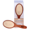 A minimalist wooden paddle brush with beige cushion and metal bristles on a neutral surface