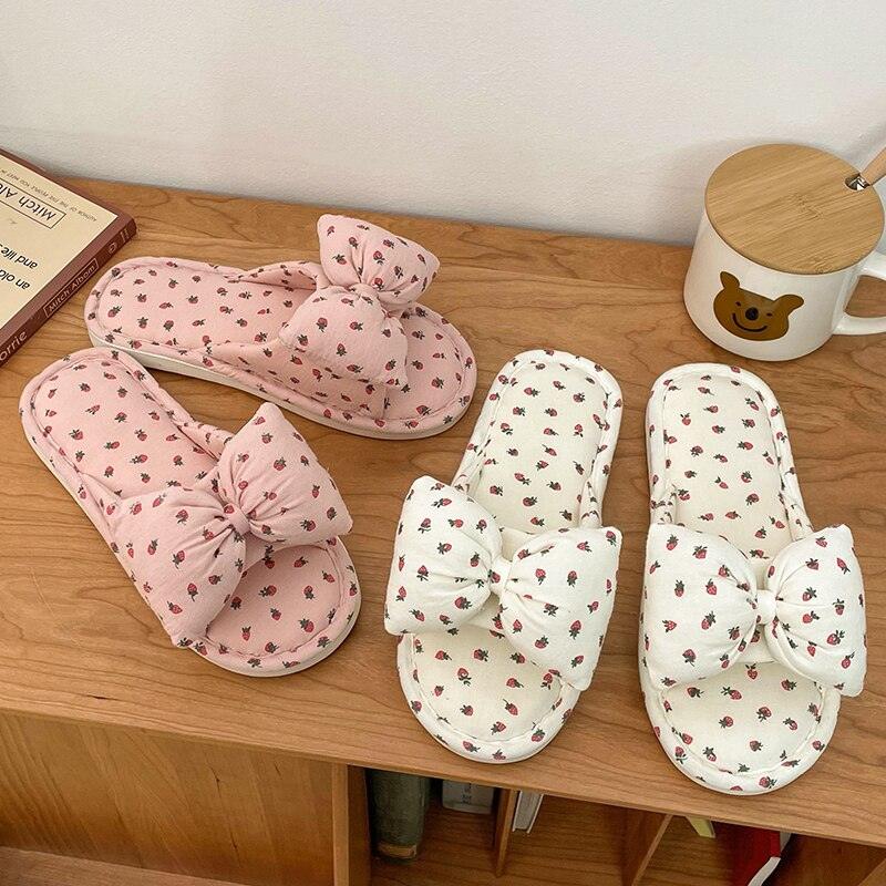 Elegant striped pink and white women's slippers with ribbon bow detail and open-toe design
