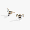 Close up of gold and silver bee stud earrings with iridescent mother-of-pearl wings and crystal details