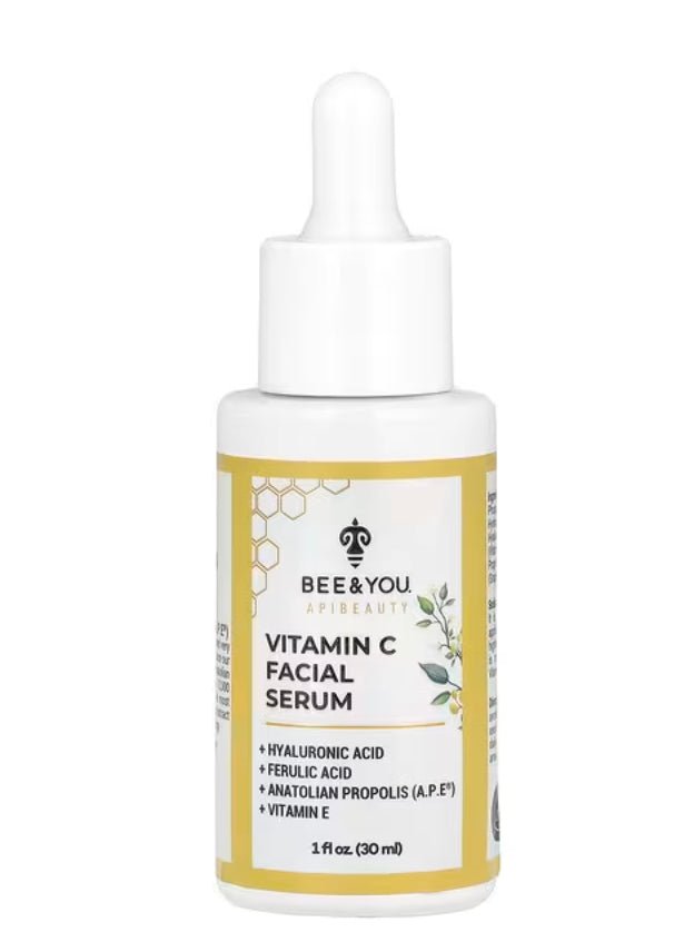 Bee & You Vitamin C Facial Serum bottle with Hyaluronic Acid and Anatolian Propolis on a white and yellow background