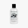 Beekman 1802 Ylang Ylang & Tuberose Goat Milk Conditioner bottle in minimalist black and white packaging