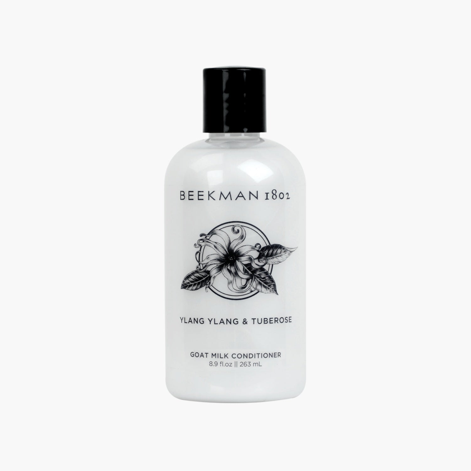 Beekman 1802 Ylang Ylang & Tuberose Goat Milk Conditioner bottle in minimalist black and white packaging