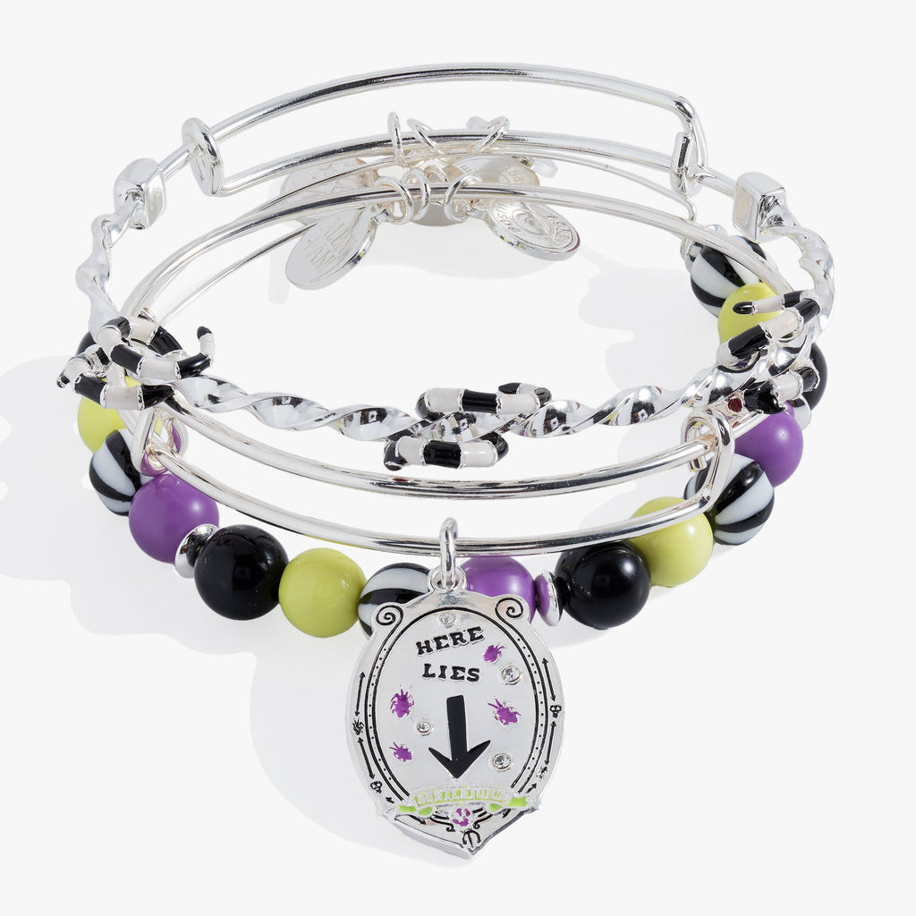 Set of three BEETLEJUICE™ bangles featuring striped beads and sandworm-themed silver chain details.