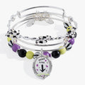 Set of three BEETLEJUICE™ bangles featuring striped beads and sandworm-themed silver chain details.