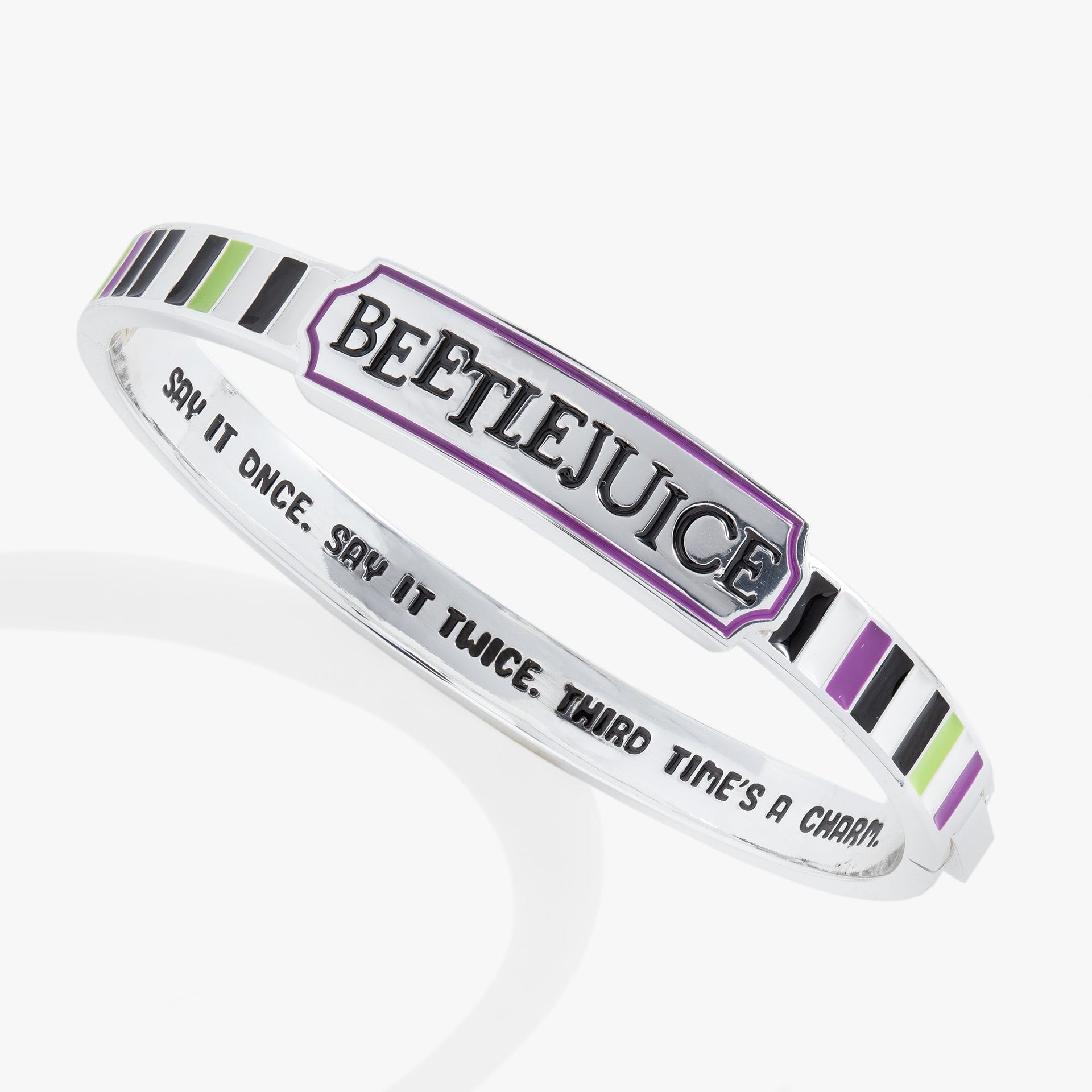 Beetlejuice hinge cuff bangle featuring purple, green, black, and white stripes with Beetlejuice logo.