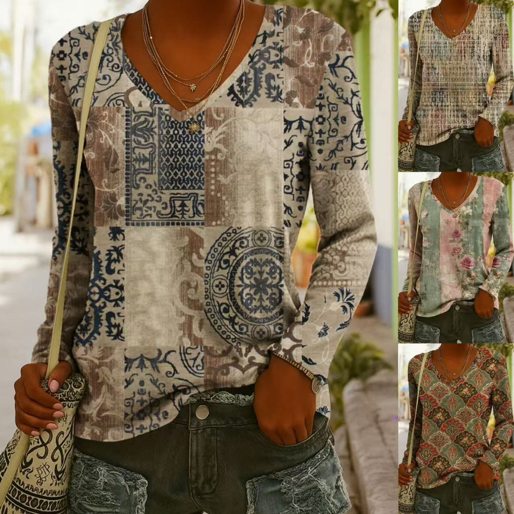 A woman wearing a long-sleeve V-neck top with an ethnic bohemian pattern paired with denim shorts.
