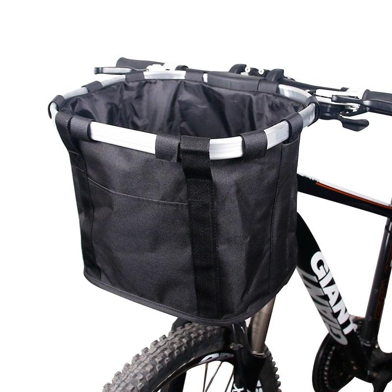 Black detachable handlebar bicycle basket that functions as a grocery carrier or small pet bag.