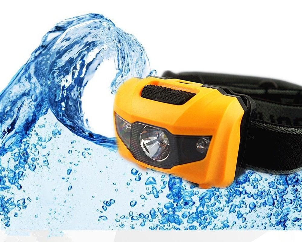 Adjustable LED headlamp with white and red light modes for outdoor hiking and camping.