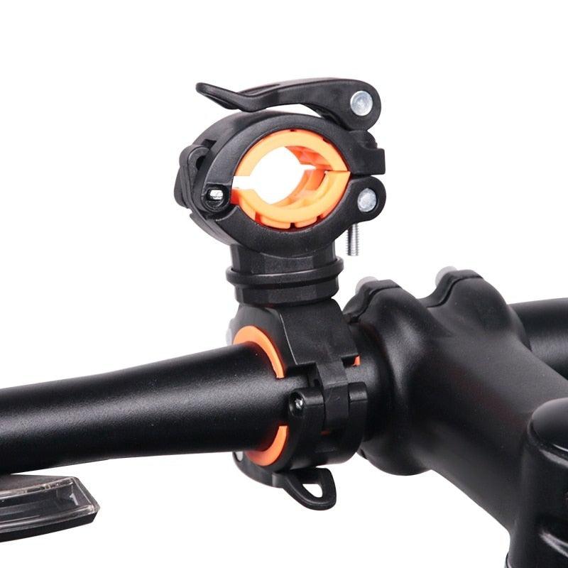 Universal 360-degree rotatable bicycle light bracket mounted on a handlebar