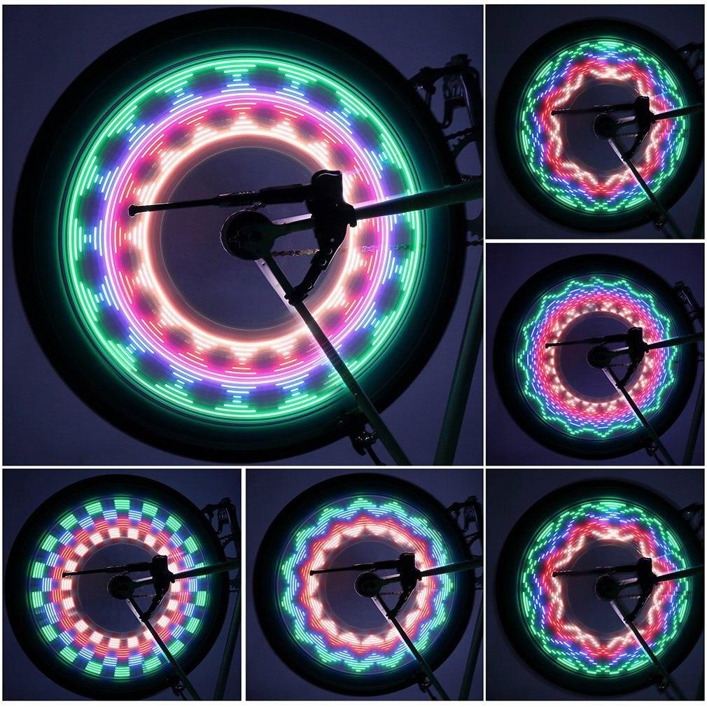 LED spoke lights mounted on a bicycle wheel glowing in the dark