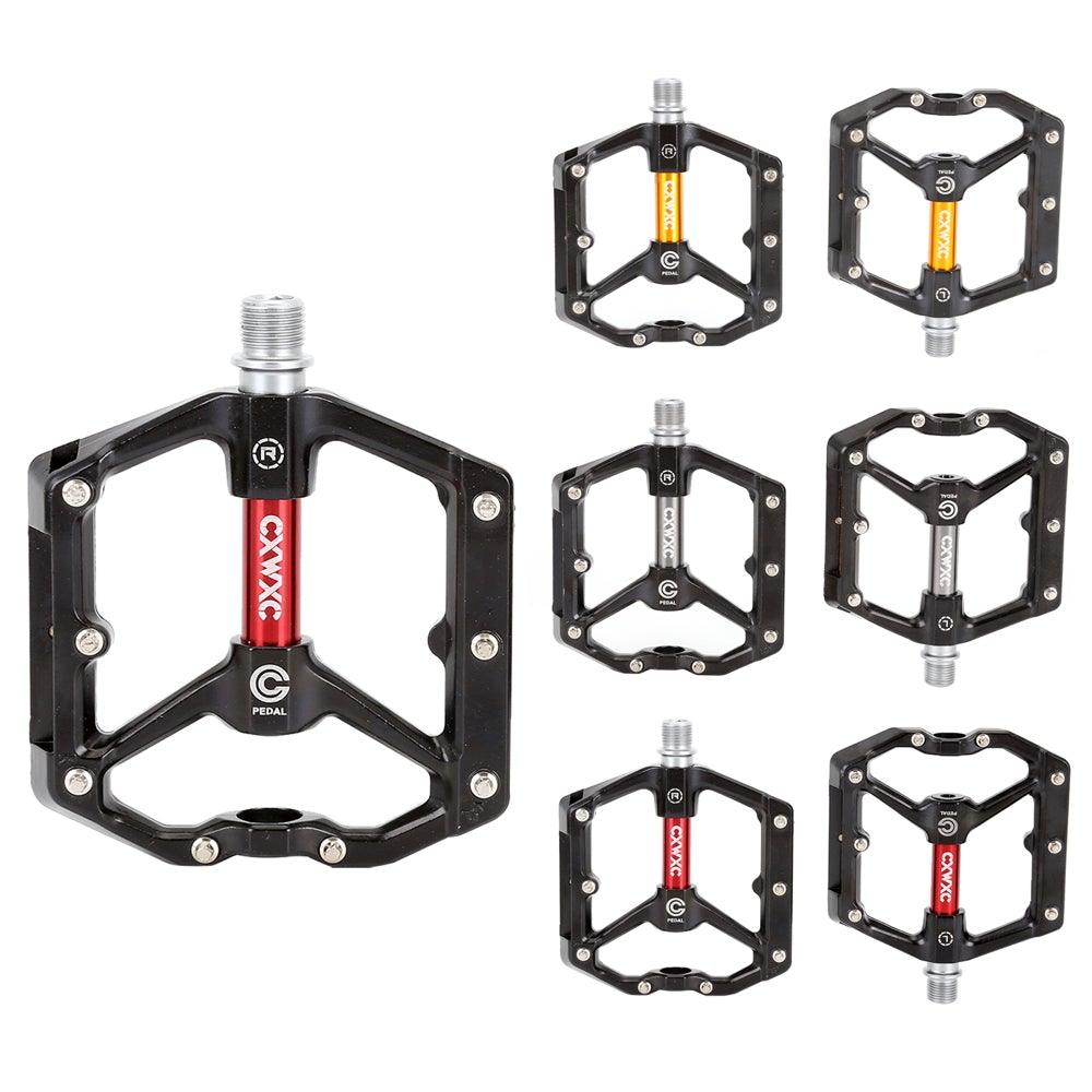 Durable aluminum mountain bike pedals in black with visible anti-skid pins.