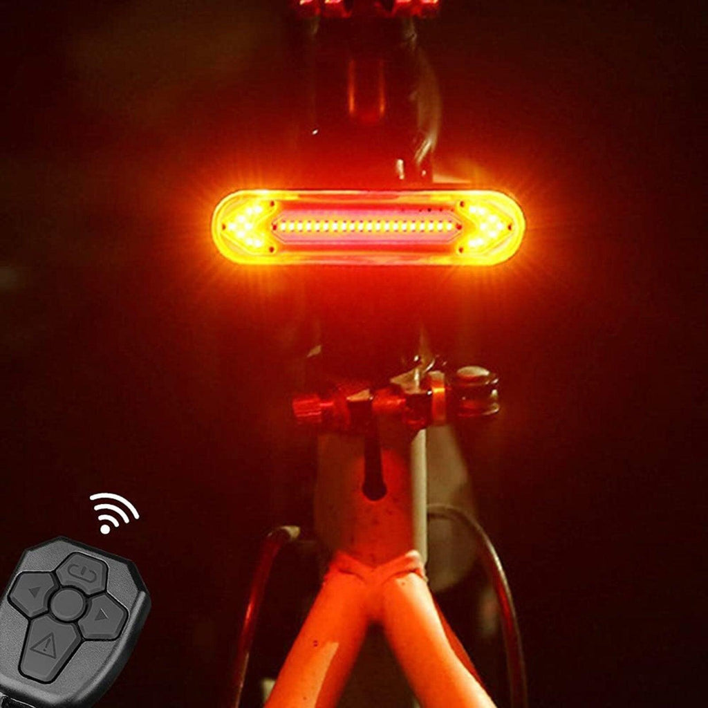 Stevvex wireless LED bicycle turn signal taillight with remote control attached to a bike seat post