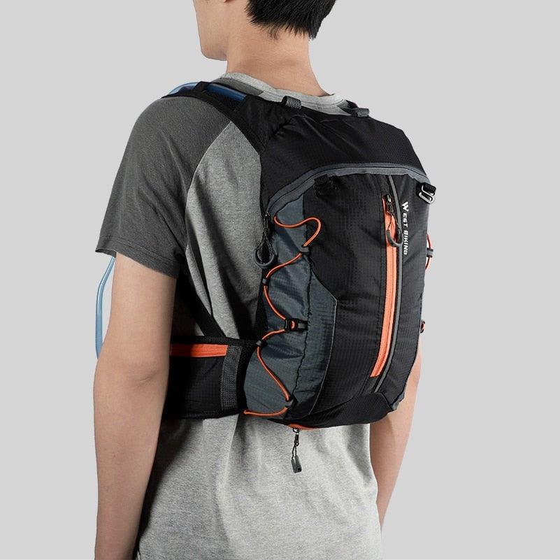 Stevvex 10L waterproof hydration backpack for cycling and hiking on a trail