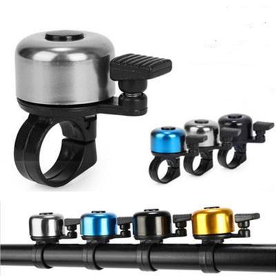 Durable metal bike bell with anti-rust coating mounted on a child's bicycle handlebar