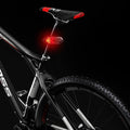 Stevvex LED bike rear light with wireless remote control attached to a bicycle seat post.
