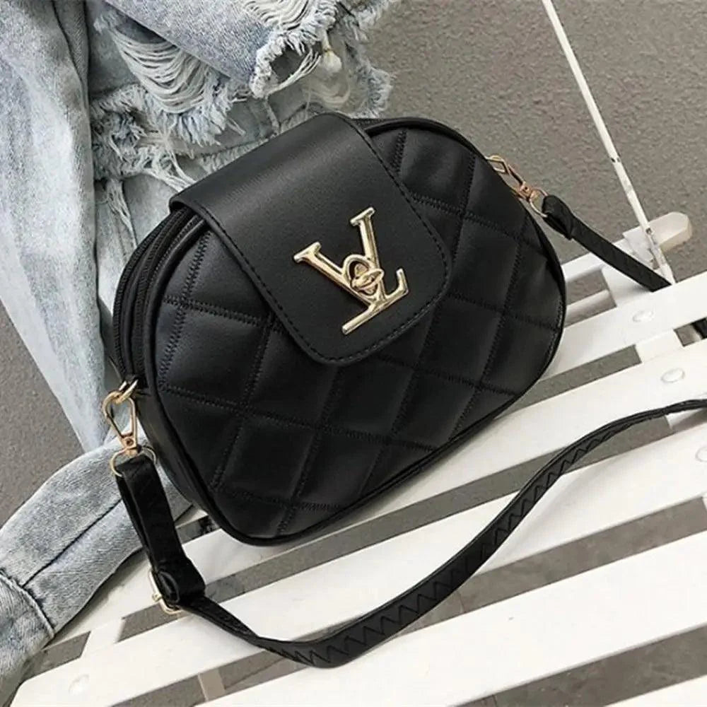 Black designer style shoulder crossbody bag with secure lock closure