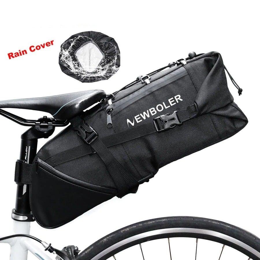 Black waterproof roll-top bicycle seat bag mounted under a bike saddle