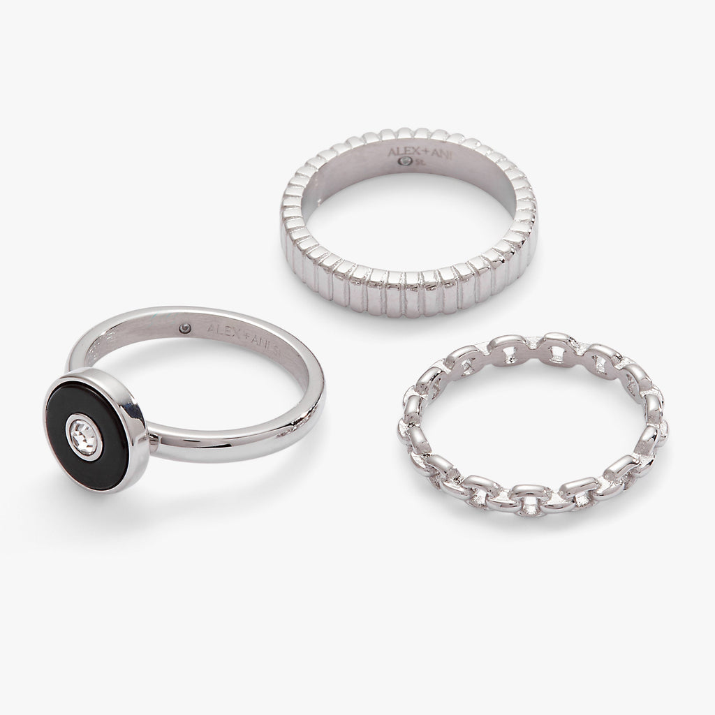 Three-piece ring set featuring a black onyx and clear crystal statement ring with two textured silver stacking bands