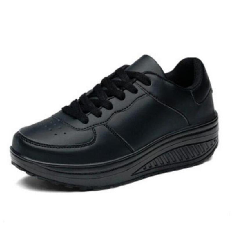 Classic black PU leather platform low-top sneakers with white soles and lace-up closure