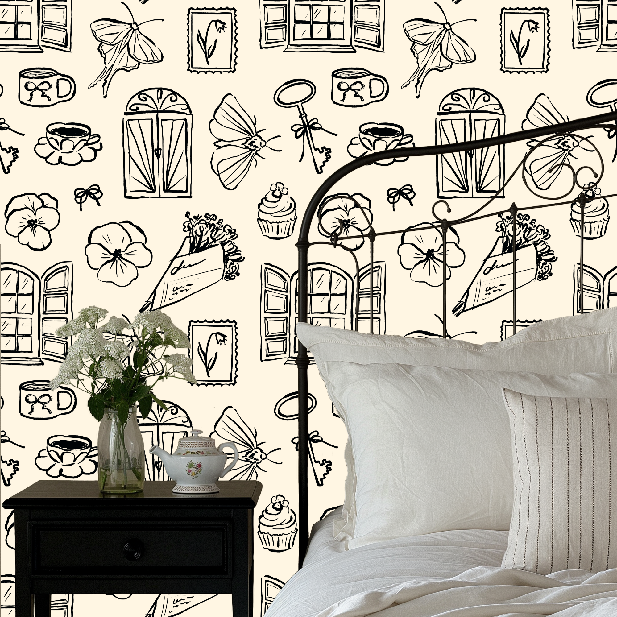 Close up of Lucille vintage illustrative wallpaper in cream and black on a white wall