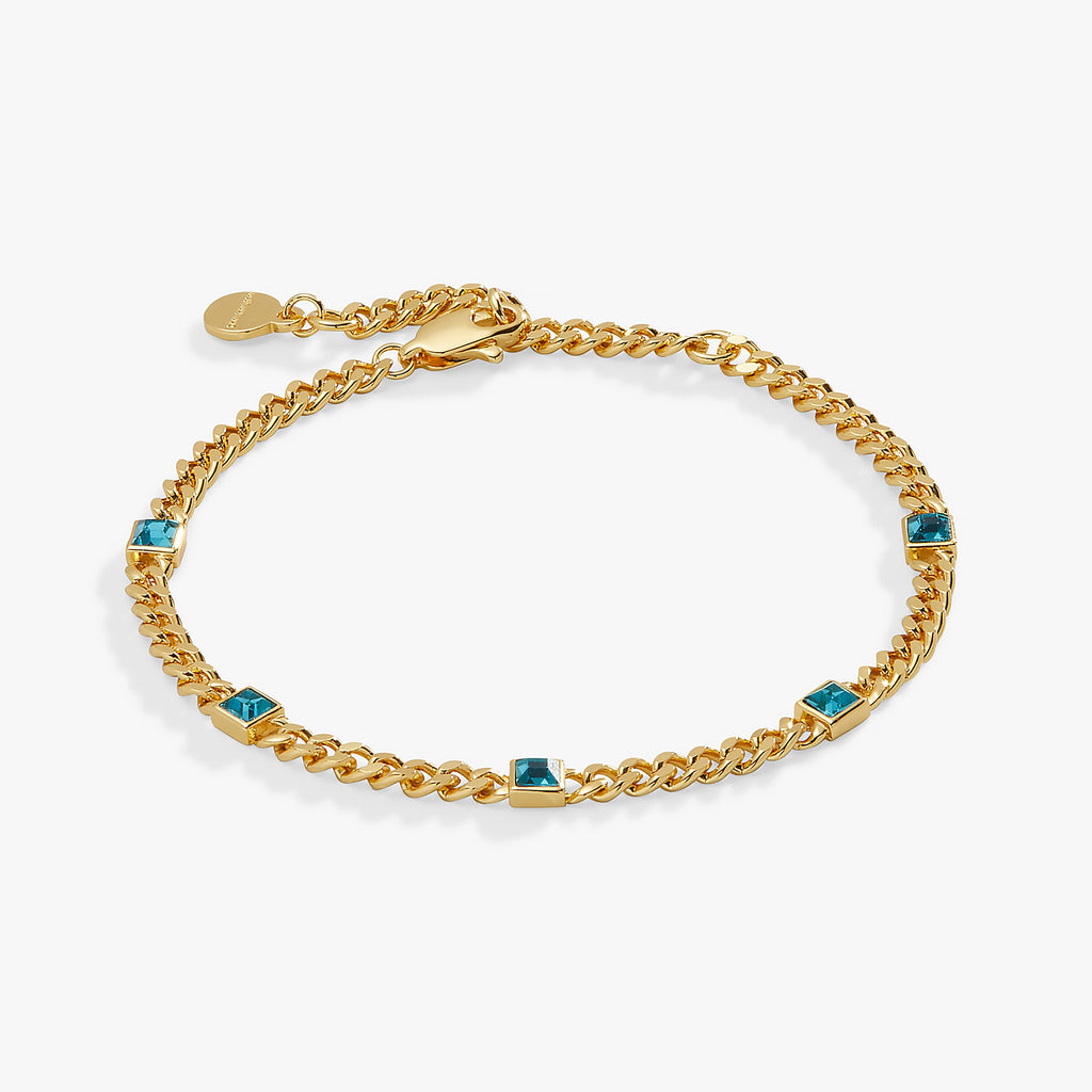 Princess-cut blue zircon crystals set on a sleek curb chain bracelet