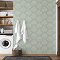 Bridgerton wallpaper with romantic floral patterns in sage-green and cream
