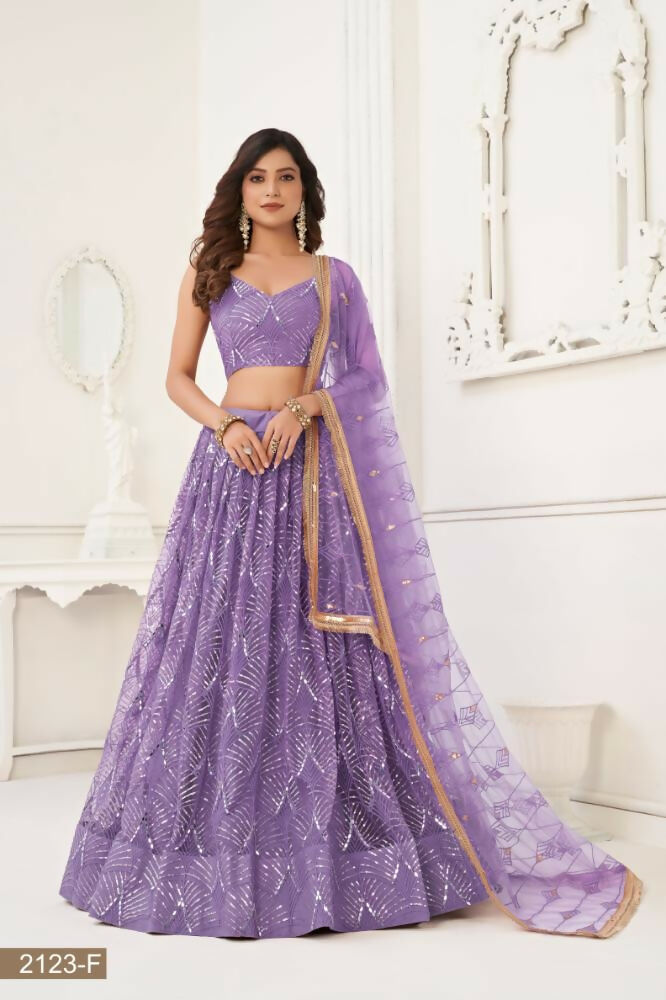 Lavender butterfly net wedding lehenga choli adorned with original mirror work and sequence embroidery.