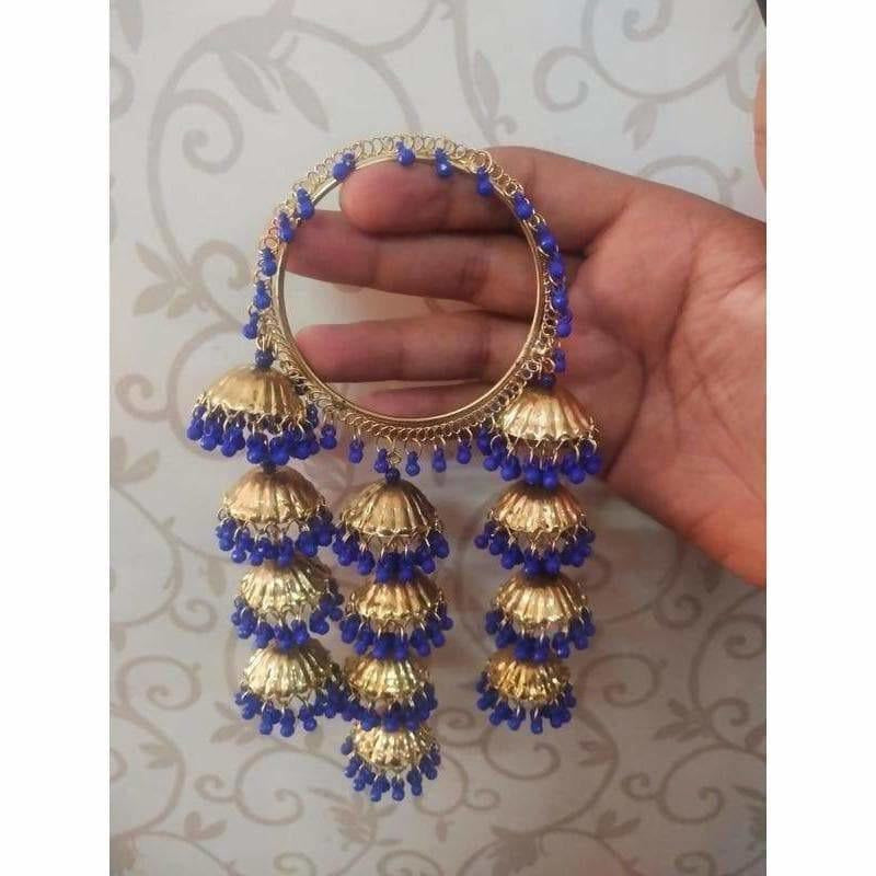Trendy gold-tone latkan bangles with blue pearl accents and hanging jhumkas.