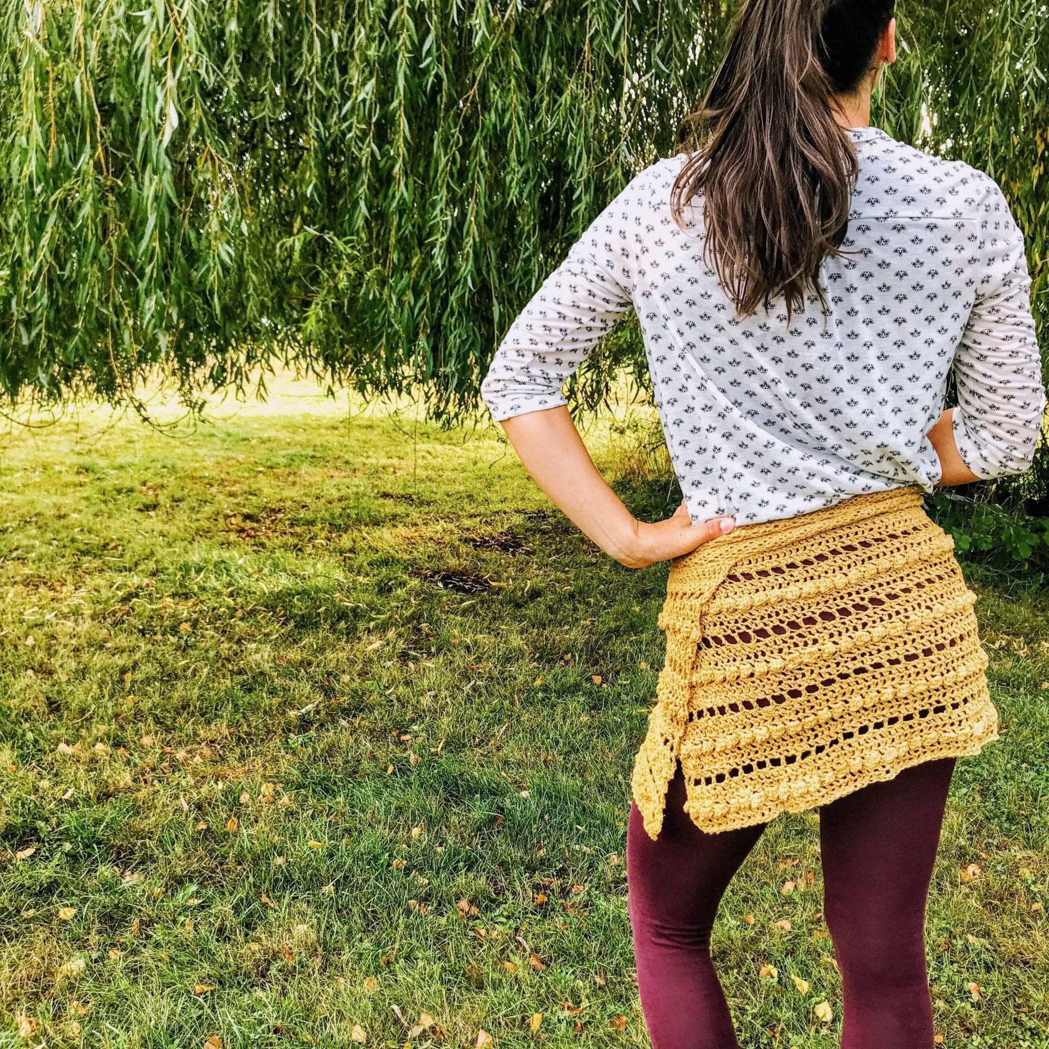Close up of a handmade crochet wrap skirt featuring intricate bobble stitch detailing.