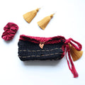 Boho style handmade Tunisian crochet clutch purse featuring a textured design