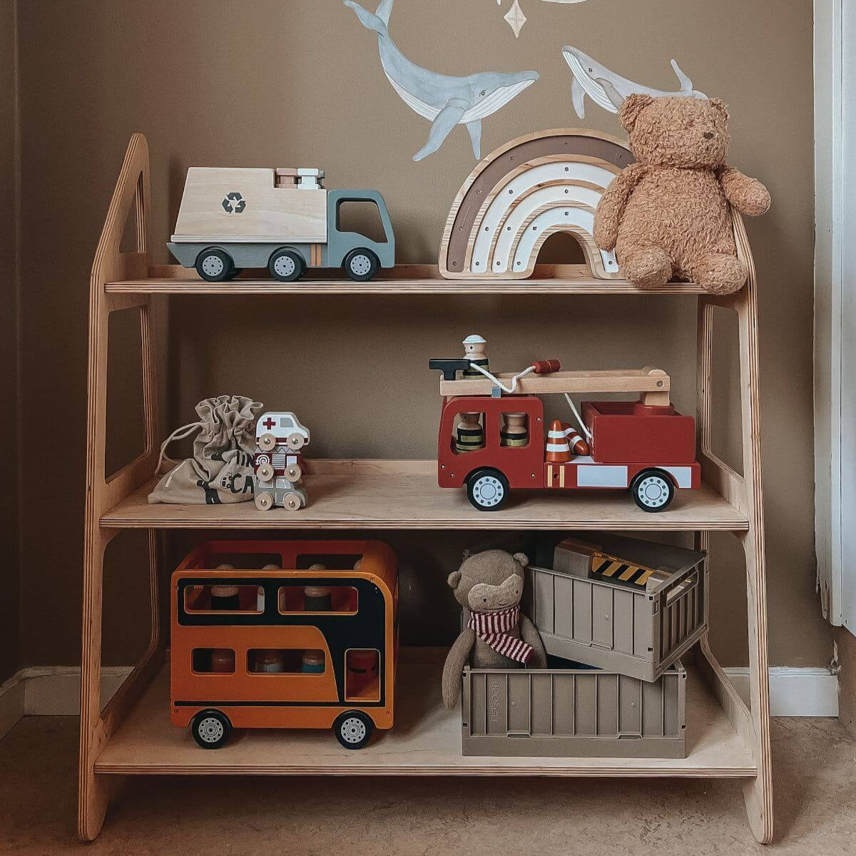 Small wooden Montessori toy shelf in a clean nursery setting