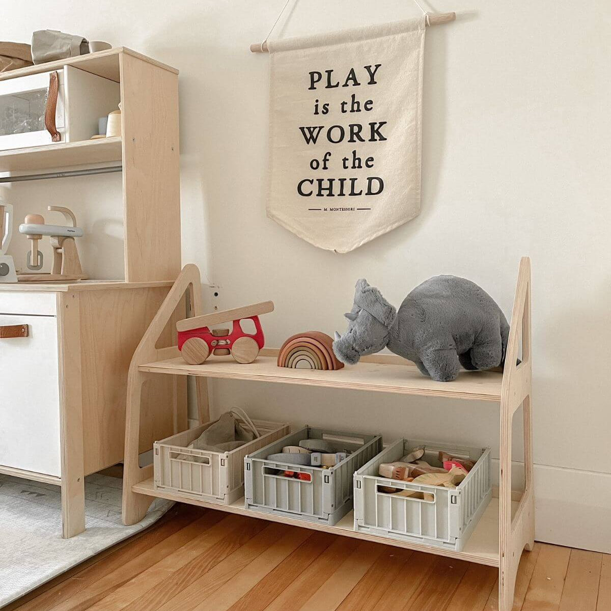 Minimalist wooden Montessori toy shelf in natural wood finish for nursery toy storage