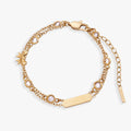 Double strand bracelet with bow symbols and crystal accents in polished metal