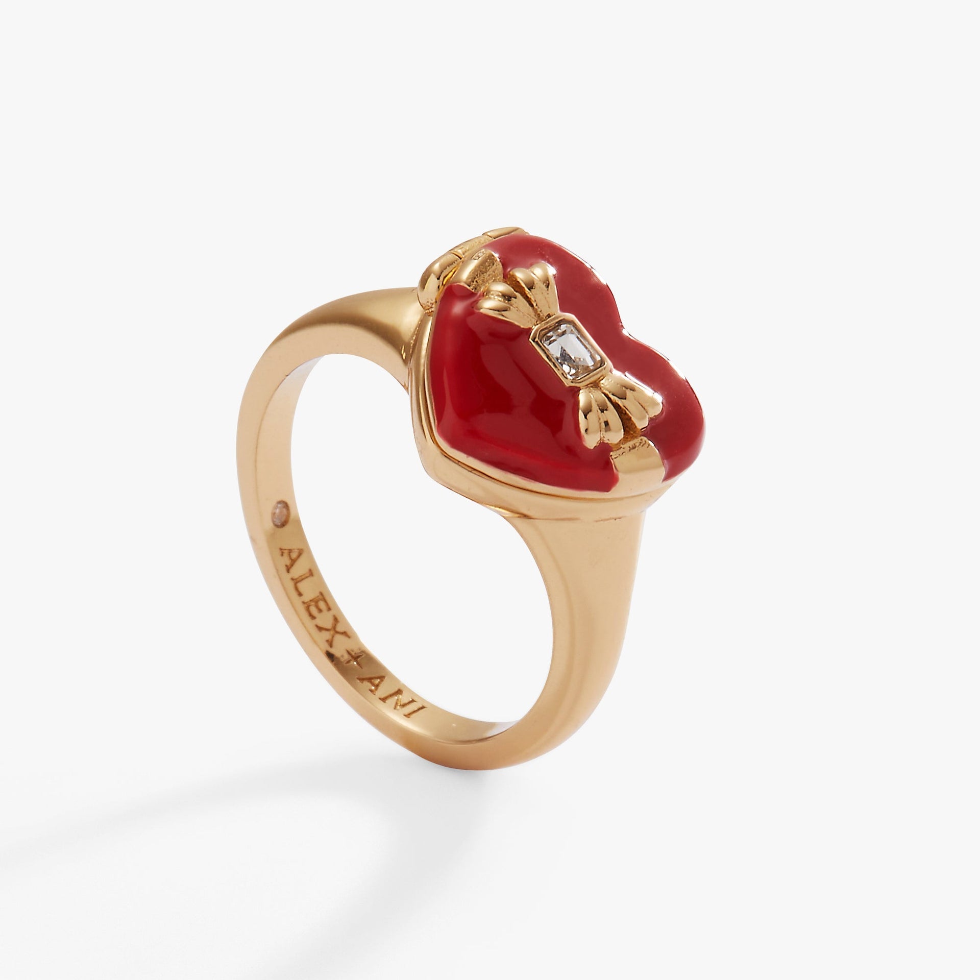 Gold-tone heart-shaped locket ring with crystal bow and sparkling chocolate-colored crystals inside.