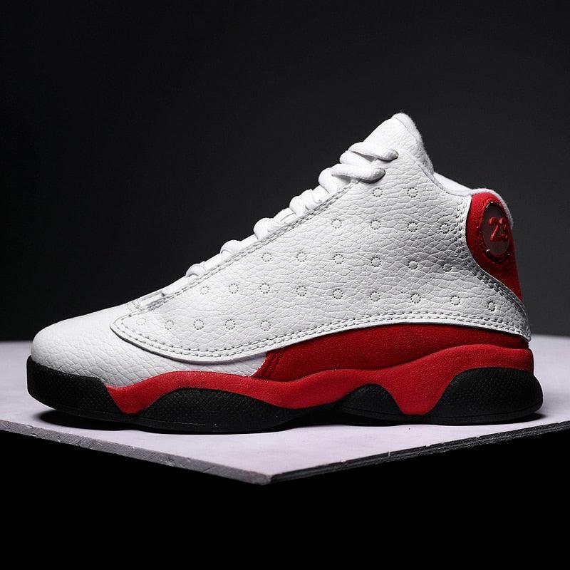 Boys leather basketball sneakers in a classic red, white, and black colorway with lace-up closure.