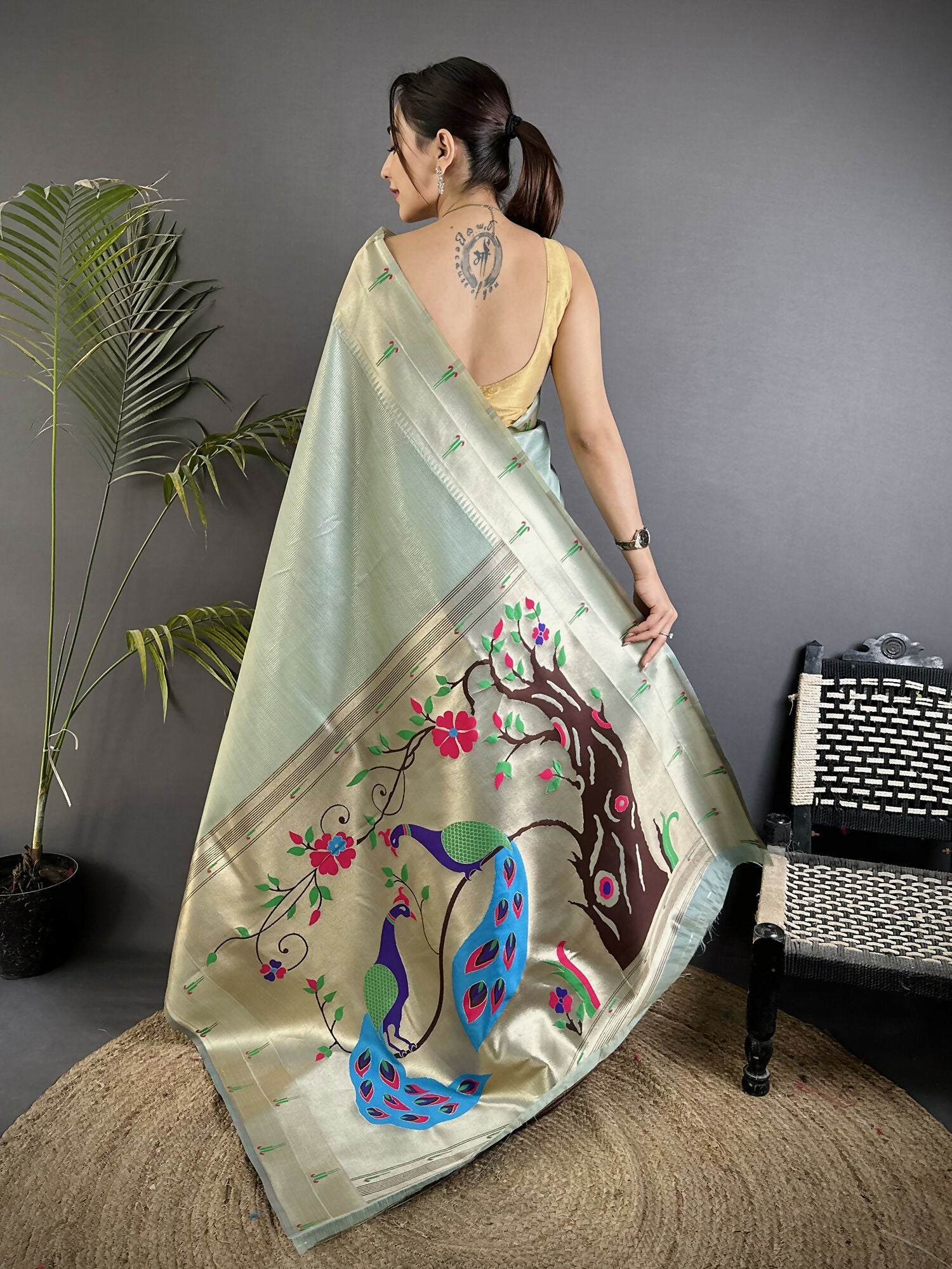 Pale Blue Tissue Paithani Saree with Peacock and Floral Motifs