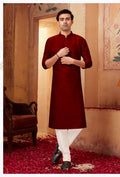 Boy wearing a traditional Maron art silk kurta with off-white pyjamas