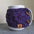 Braided Cable Mug Coozie Knit Kit featuring a cozy, textured knit sleeve on a coffee mug
