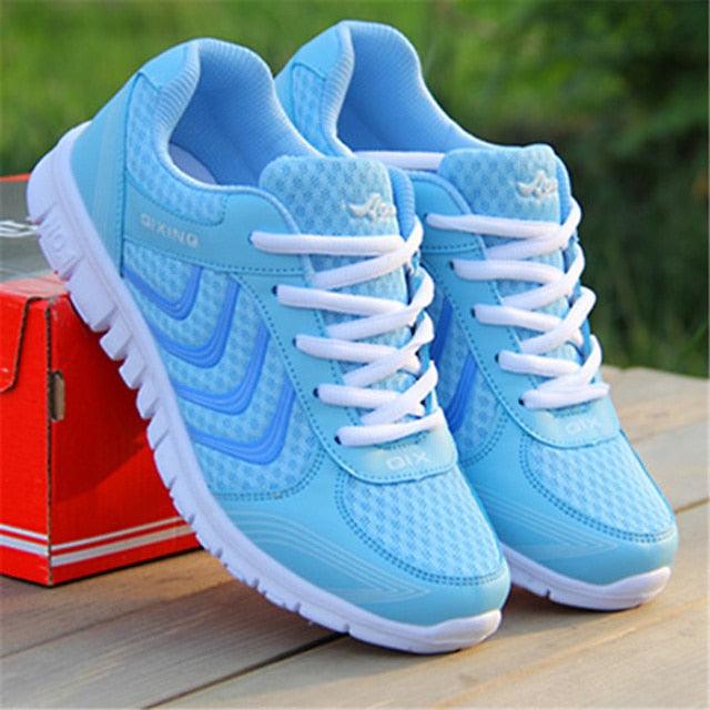 Stevvex women's white breathable mesh athletic running sneakers with lace-up closure