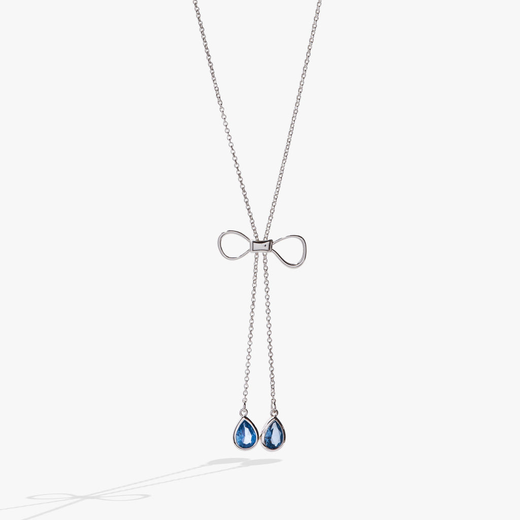 Delicate gold-tone bow slider necklace with adjustable 30-inch chain